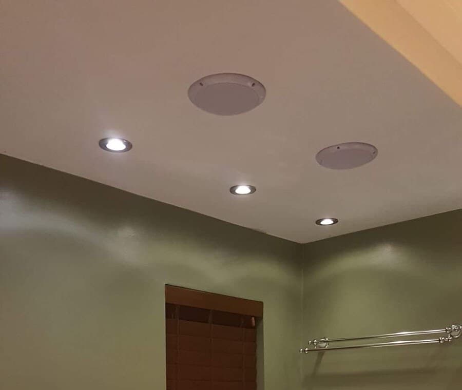 Bathroom ceiling with four recessed downlights and two flush ceiling speakers